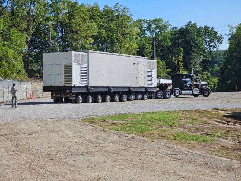Oversized data center module staged on a specialized multi axle trailer at the delivery site in Cadiz, Ohio