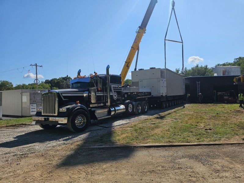 Crane assisted unloading of the Gen2 data center module from the heavy haul tractor and trailer at the Ohio delivery site