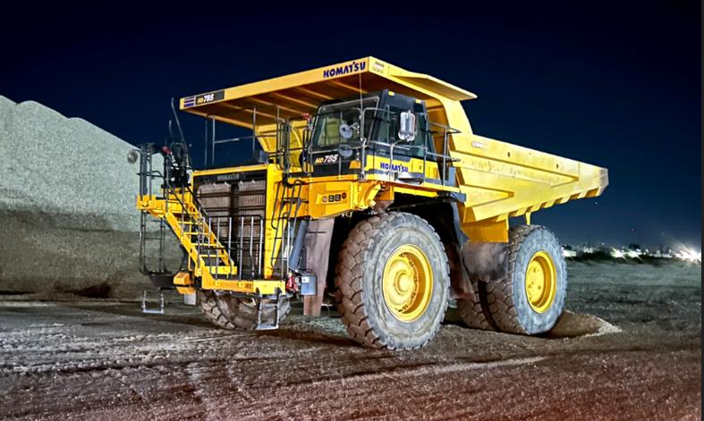 Reassembled Komatsu HD785 rock truck at the Rialto, California delivery site at night